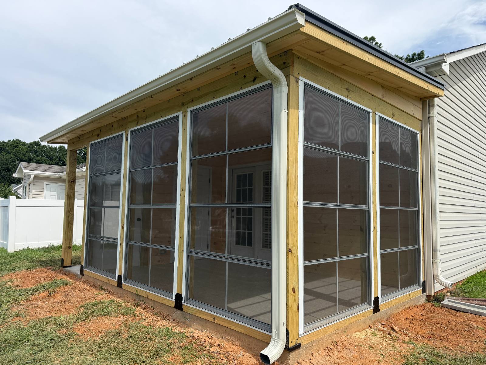 Custom Eze-Breeze® Sunroom with Vertical 4-Track Windows & Aluminum Door